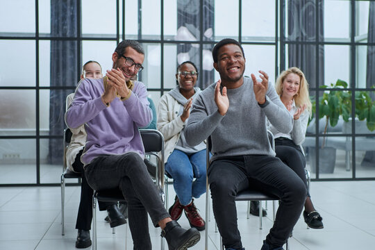 happy friendly diverse professionals, teachers and students giving high five while