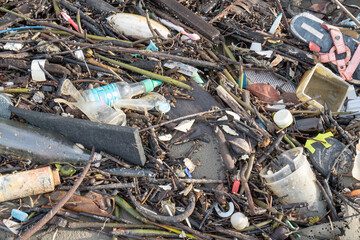 A sandy beach filled with human-made garbage
