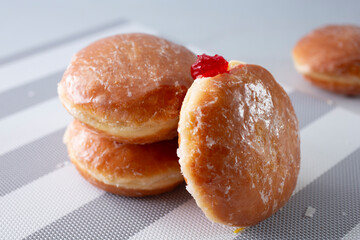 A view of some glazed jelly filled donuts.