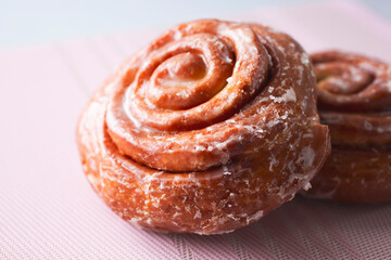 A closeup view of some cinnamon rolls.