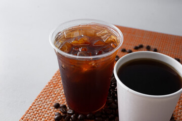 A view of a coffee in hot form and in cold form.