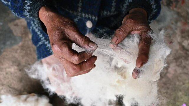 woman working wool with her hands
