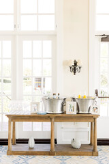 Elegant beverage station with champagne and juice in ice buckets