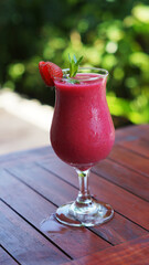 fresh strawberry juice on the wooden table