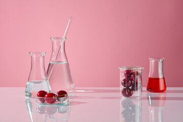 White table contains some erlenmeyer flask of transparent liquid on the left, a beaker of fresh...