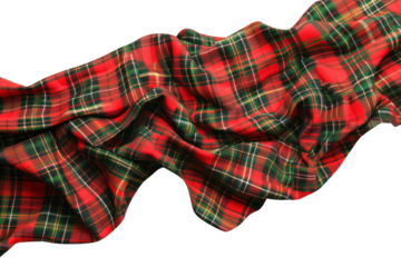 Vibrant red and green plaid fabric crumpled and spread out, showcasing its colorful and detailed pattern. Ideal for textile and design projects.