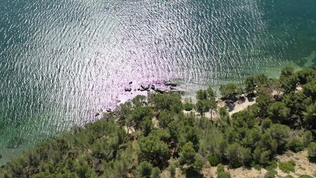 Aerial view drone video flying from the air over the picturesque sea coast of the south of France, Provence, Istres at bright sunny summer day