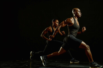 Fototapeta premium Running Fitness Duo in Motion at Night