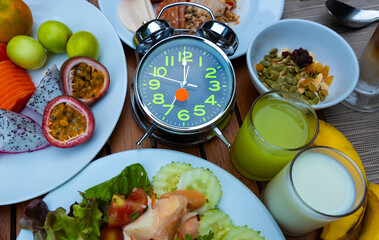 Alarm clock with IF (Intermittent Fasting) 16 and 8 diet rule and weight loss concept.-Diet plan concept