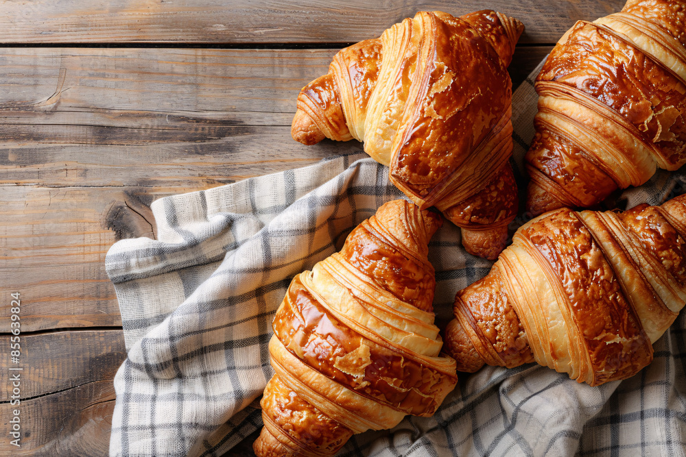 Poster classic french croissants arranged in a pile stock photo with copy space isolated on white backgroun