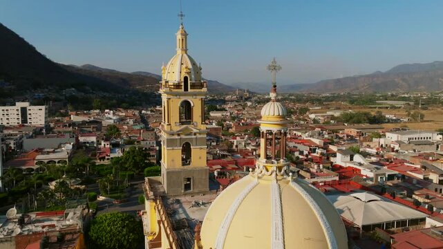 Extremely close drone flight between the towers of Our Lady of the Sanctuary Church, Tamazula de Gordiano, Mexico. Dolly in