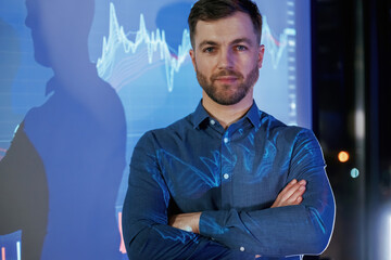 Front view, portrait. Business coach against projector with data
