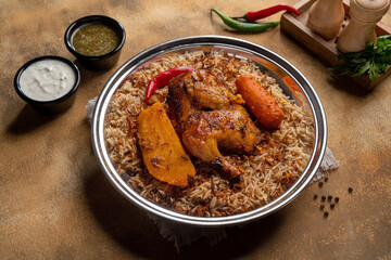 Delicious colorful Afghan rice pilaf Kabuli pulao with lamb or Chicken and raisin, carrot, nut,...