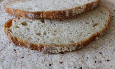 Closeup stock photo of homemade bread slices on the surface of yeast free lavash with grains
