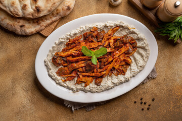 Sliced Steak or Chicken Mushroom Sliced meat grill and cooked with mushroom, served with mutabal.