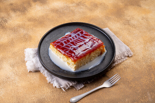 Caramel trilece dessert on stone background. Traditional Turkish cuisine flavor. close up