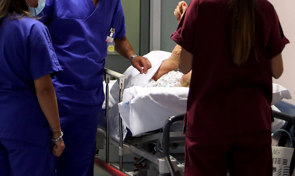 Doctors and nurses in the corridors of the emergency room of an Italian hospital. Triage, code red and code yellow. Italian healthcare