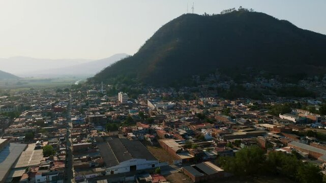 Cerro de la Mesa Natural Park and the city of Tamazula de Gordiano in Mexico. Drone orbit aerial