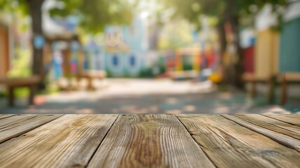 a close up of a rustic empty wooden table with blurred kindergarten background