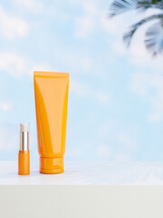 A tube mockup in orange color and a lipstick on a white pedestal with a blue sky in the background.