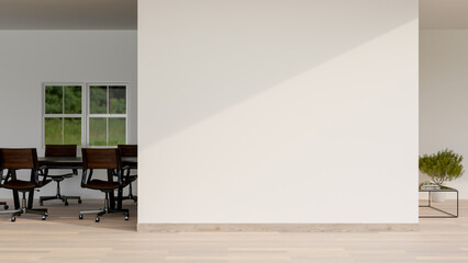 A minimalist office corridor features a parquet floor, a white empty wall, and a meeting room.