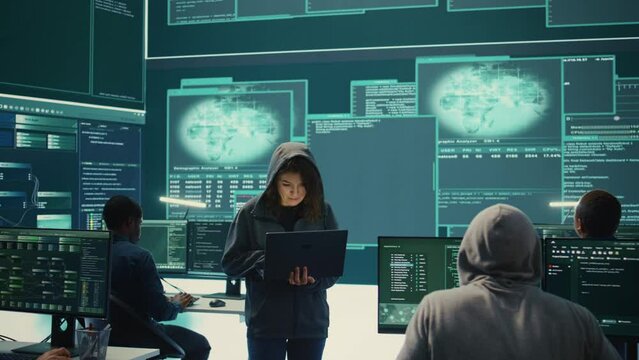 Hackers group failing to hack a system in high tech agency office, reading critical error message on big screen. Specialists trying to steal important database information from rival states. Camera B.