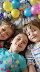 three children at the Birthday party, lying down,tres ni&ntilde;os en la fiesta de cumplea&ntilde;os, acostados