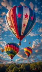 Obraz premium Colorful hot air balloons floating gracefully in a blue sky filled with clouds
