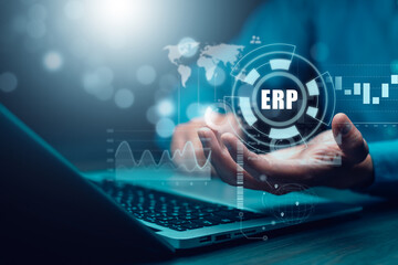 Business people using a laptop with document management for ERP. Enterprise resource planning...