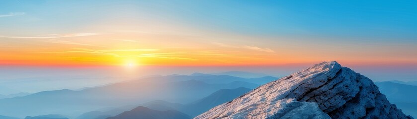 majestic mountain peak sunset over blue haze landscape.