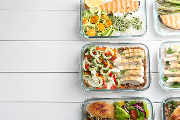 Healthy meal. Containers with different products on white wooden table, flat lay. Space for text