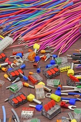 Materials for electrical installation work during the assembly of electrical equipment. Close-up. Soft focus.