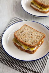 Homemade Pickle Sandwich with Mayo and Cheese on a Plate, side view.