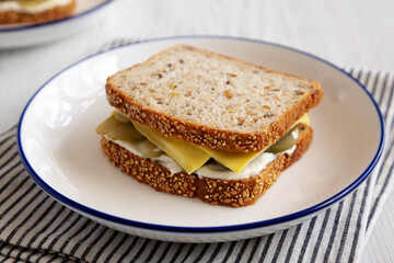 Homemade Pickle Sandwich with Mayo and Cheese on a Plate, side view.