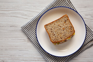 Homemade Pickle Sandwich with Mayo and Cheese on a Plate, top view. Copy space.