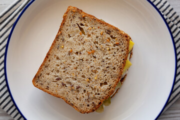 Homemade Pickle Sandwich with Mayo and Cheese on a Plate, top view. Overhead, from above.