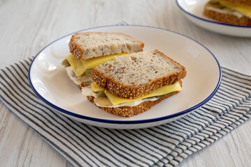 Homemade Pickle Sandwich with Mayo and Cheese on a Plate, side view.
