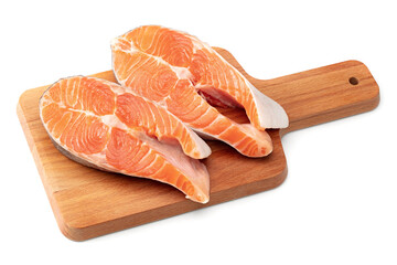 slices of raw fish, salmon, trout, steak, on wooden board isolated on white background, clipping path