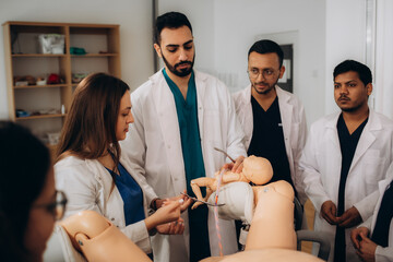 training obstetrician-gynaecologist students at the university to deliver babies