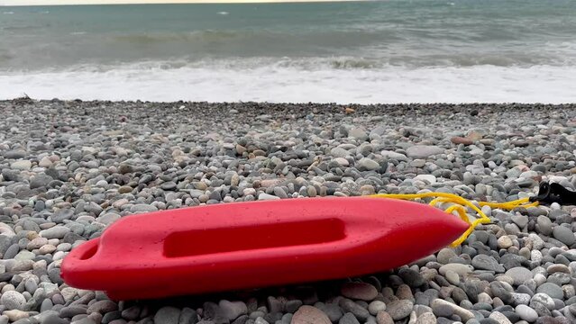 Lifeguard float on the seashore in the sand