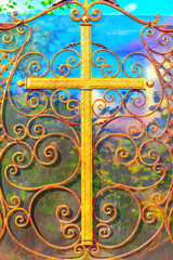 Religious cross forged on fence. Religious symbol of faith