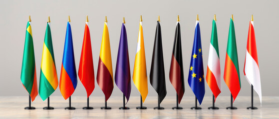 A row of flags from different countries are lined up on a table