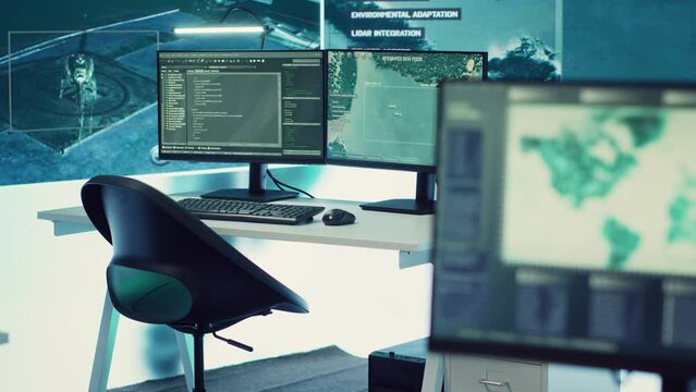 Empty military command headquarters with a big display and workstations used for reconnaissance and surveillance monitoring on a world map. Army intelligence gear and CCTV footage, federal agency.