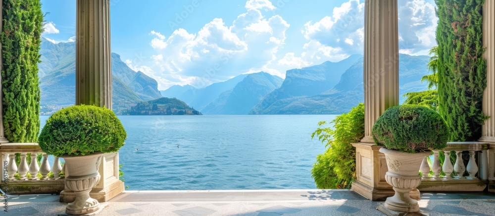 Poster entrance to classical villa looking out over lake towards mountains on summers day. copy space image
