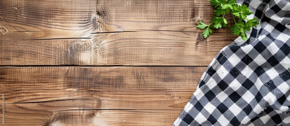 Aufkleber Checkered towel on wooden table. Food design layout. T Picnic towel on kitchen tabletop. with copy space image. Place for adding text or design