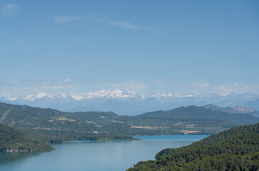 view over the beautiful Embalse de El Grado Reservoir and Hydro-electric Dam, blue summer sky, Huesca, Spain