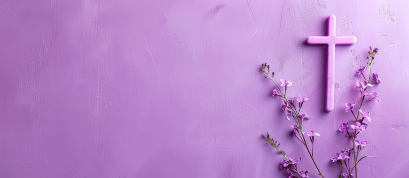 Good Friday, Lent Season and Holy Week concept - A religious cross and a flower on purple background. Copy space image. Place for adding text or design - Powered by Adobe