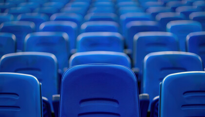 Obraz premium A row of blue chairs are empty