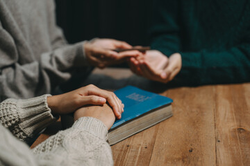 Christians are congregants join hands to pray and seek the blessings of God.