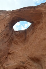 Red orange rock formations at Navajo monument valley national park USA in the summer with blue sky
